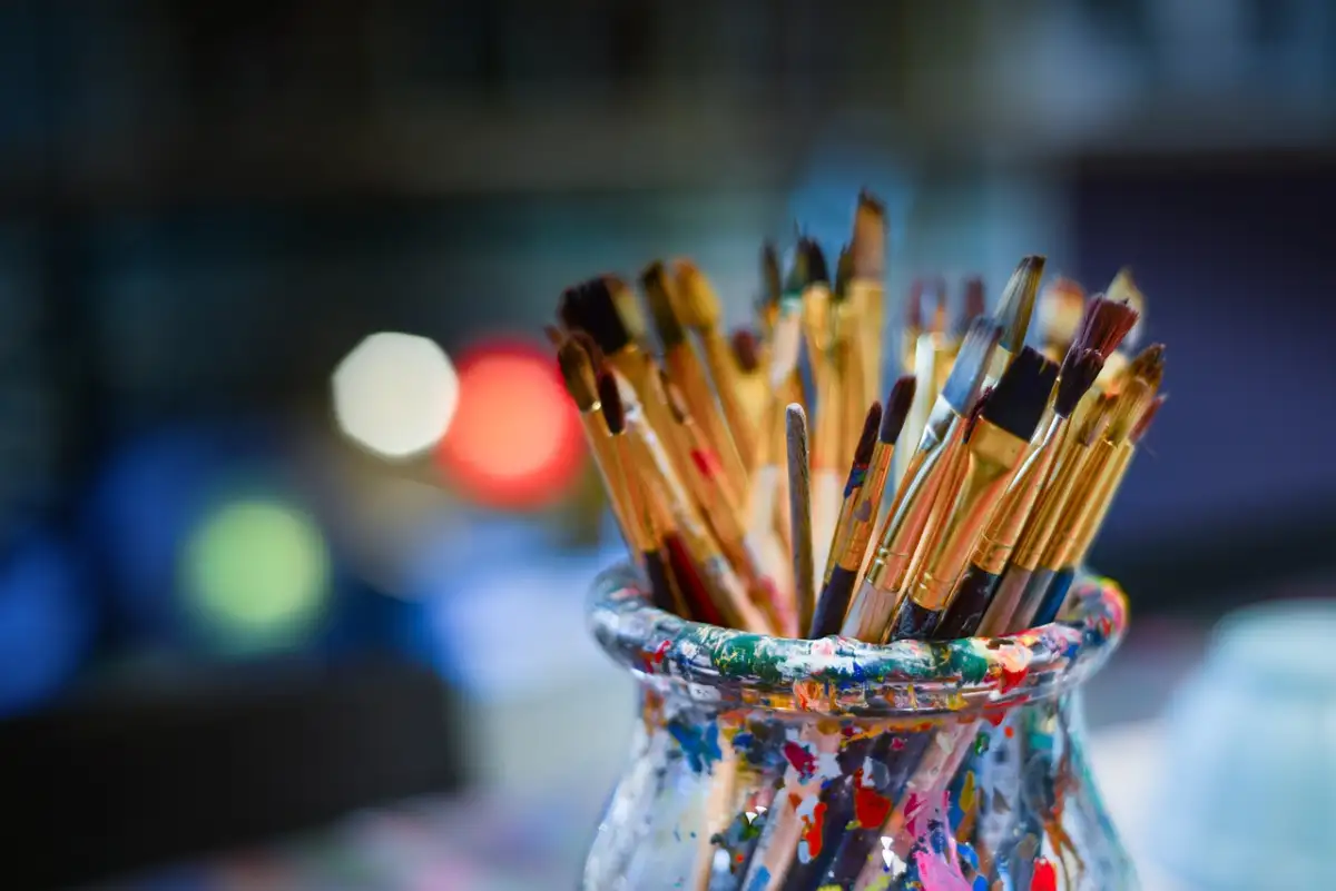 A vase of colorful paint brushes at Maui's Best Arts & Crafts Workshops.