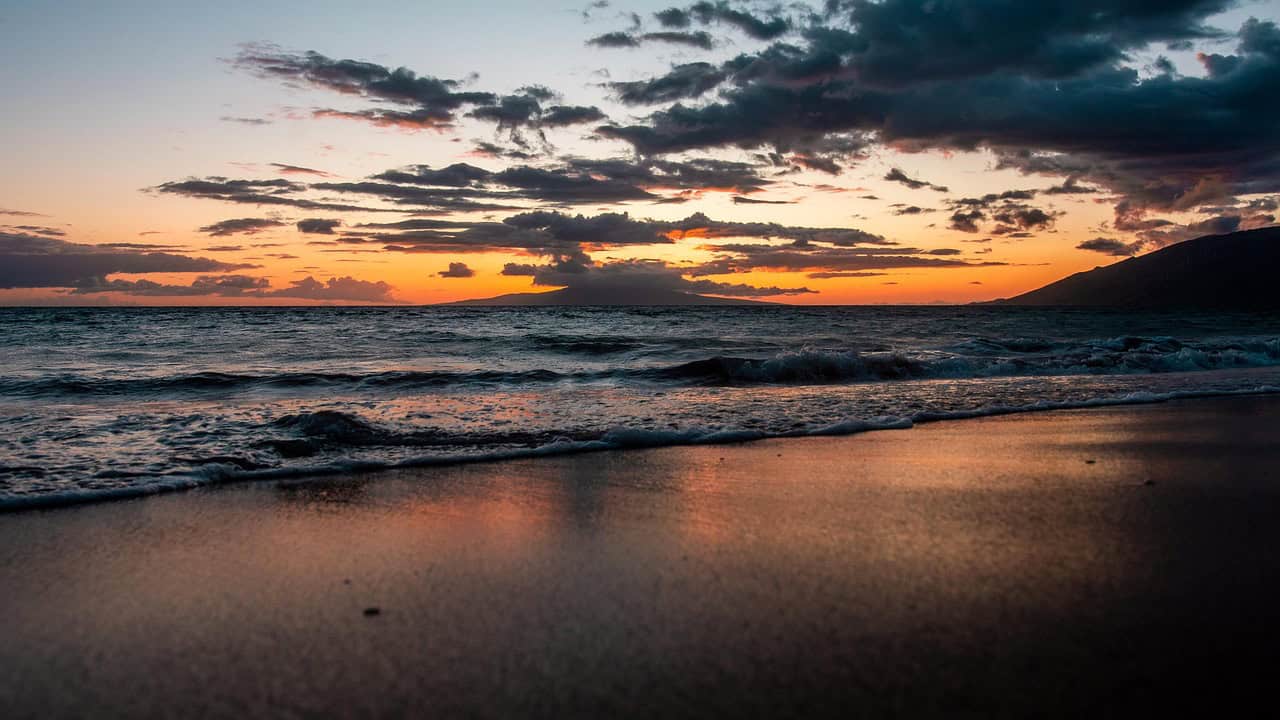 Breathtaking ocean waves and sunset on Maui.