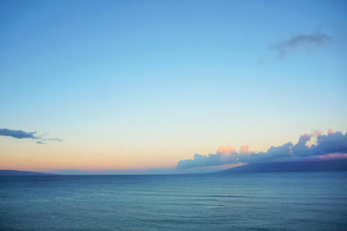 Spectacular ocean view on Maui with blue & golden sky.