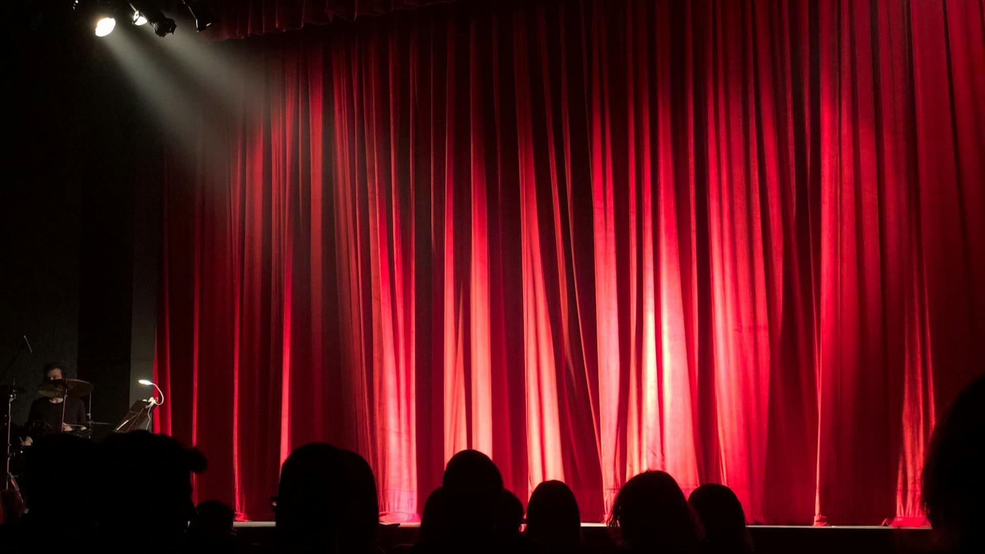 A red curtain hints at a theater performance in Maui.